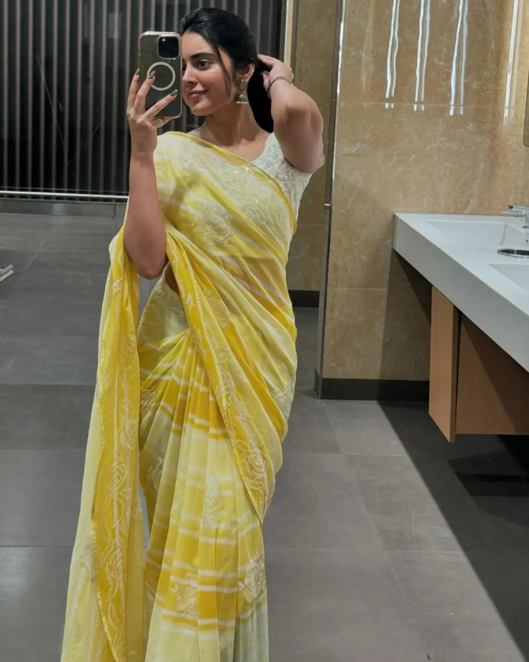 Kushita Kallapu In Traditional Yellow Saree White Blouse